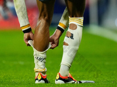 Find out why do footballers cut holes in their socks