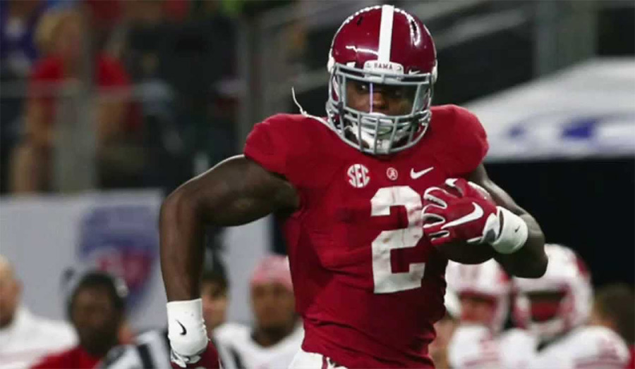 Derrick Henry powering through defenders at Alabama
