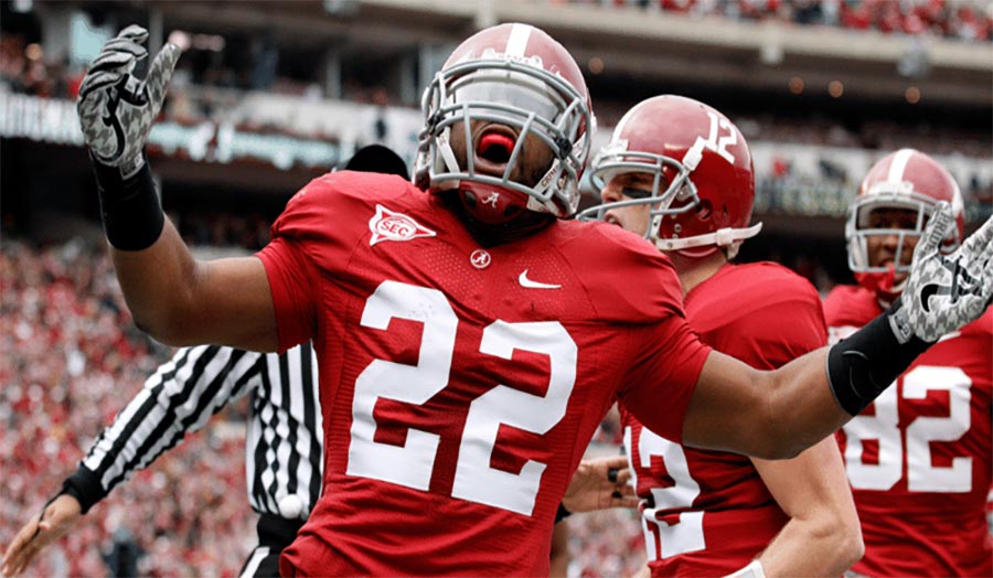Mark Ingram II carrying the ball in Alabama jersey