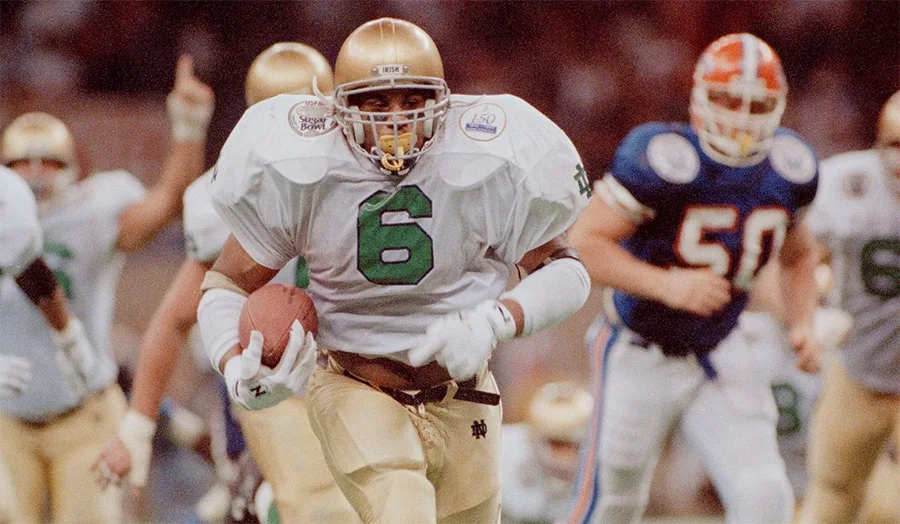 Jerome Bettis running the football for Notre Dame during the early 1990s