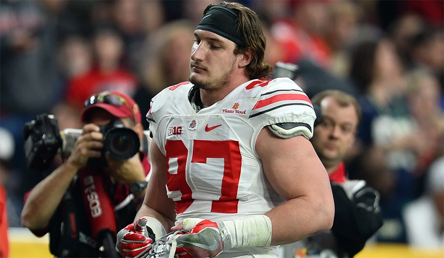 Joey Bosa rushing the quarterback for Ohio State — among the best players on Ohio State football history